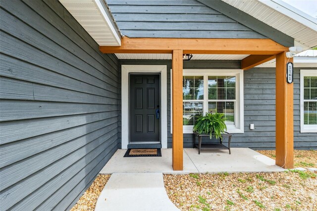 1161 Crk 443, Lake Panasoffkee, FL 33538 - view of exterior entry with covered porch
