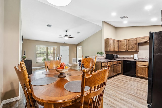 1161 Crk 443, Lake Panasoffkee, FL 33538 - dining area with light wood-type flooring, lofted ceiling, baseboards, and a ceiling fan
