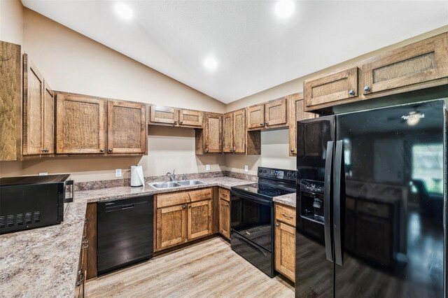 1161 Crk 443, Lake Panasoffkee, FL 33538 - kitchen featuring black appliances, a sink, lofted ceiling, light wood-type flooring, and recessed lighting
