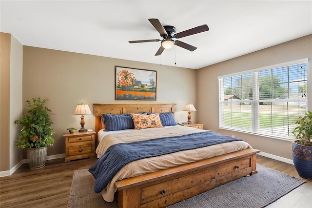 1161 Crk 443, Lake Panasoffkee, FL 33538 - bedroom with baseboards, wood finished floors, and ceiling fan
