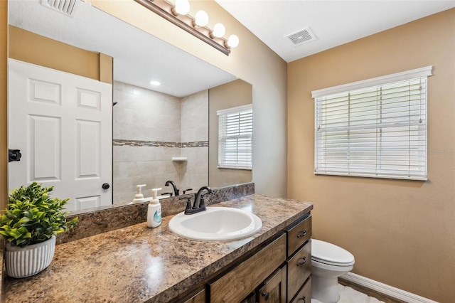 1161 Crk 443, Lake Panasoffkee, FL 33538 - full bathroom with toilet, vanity, a tile shower, and baseboards
