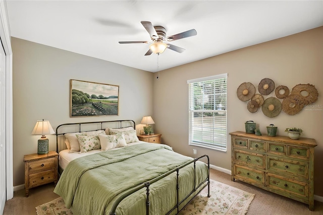 1161 Crk 443, Lake Panasoffkee, FL 33538 - bedroom with light colored carpet, baseboards, and a ceiling fan