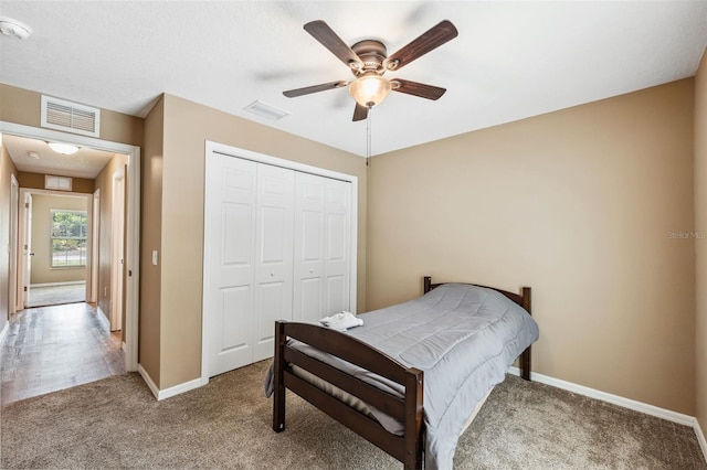 1161 Crk 443, Lake Panasoffkee, FL 33538 - bedroom with carpet flooring, a closet, baseboards, and ceiling fan