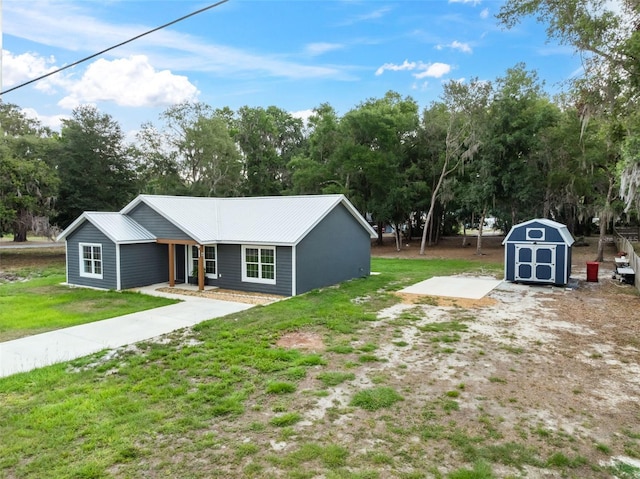 1161 Crk 443, Lake Panasoffkee, FL 33538 - view of green lawn featuring a shed, an outbuilding, and view of scattered trees