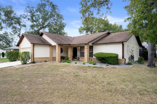 6490 Pine Meadows Dr, Spring Hill, FL 34606 - single story home featuring brick siding, a garage, a porch, a front lawn, and a shingled roof