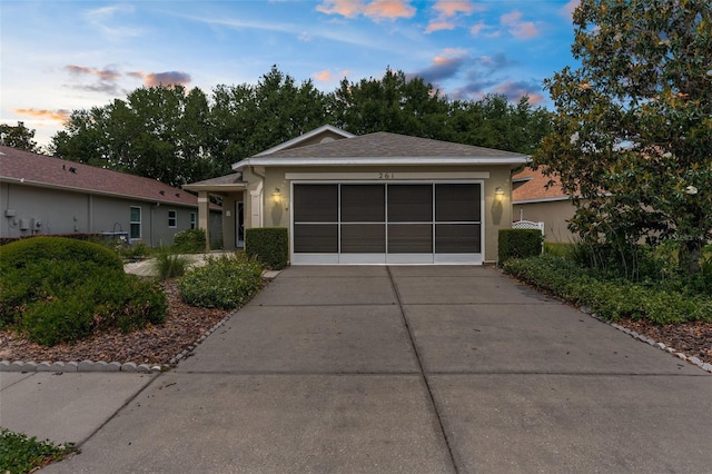 261 Rochester St, Spring Hill, FL 34609 - ranch-style home featuring driveway, a garage, and stucco siding