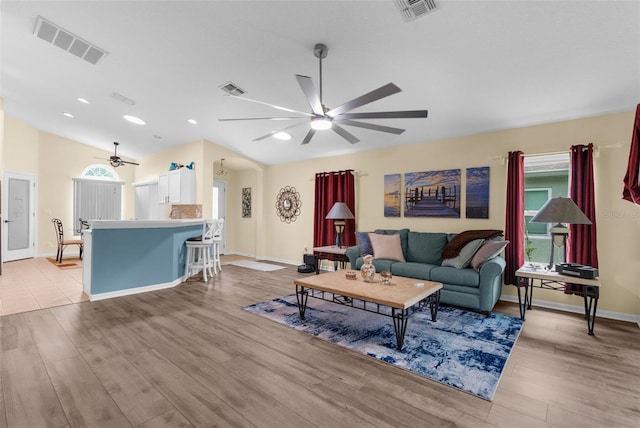 261 Rochester St, Spring Hill, FL 34609 - living room with ceiling fan, light wood-style flooring, lofted ceiling, baseboards, and healthy amount of natural light