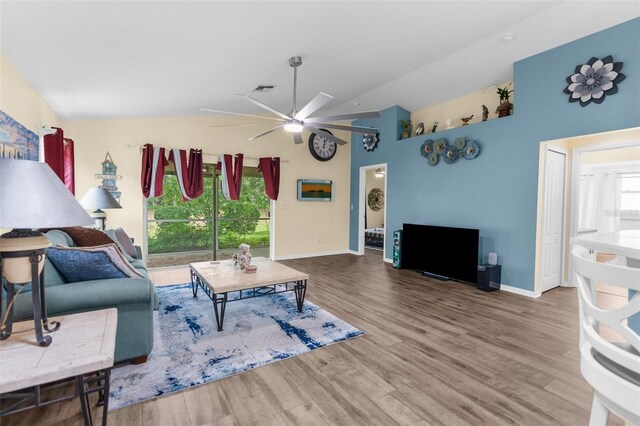 261 Rochester St, Spring Hill, FL 34609 - living area with ceiling fan, wood finished floors, baseboards, and high vaulted ceiling