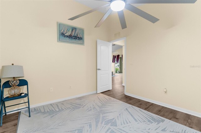 261 Rochester St, Spring Hill, FL 34609 - bedroom featuring wood finished floors, baseboards, a towering ceiling, and a ceiling fan