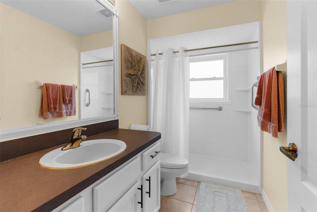 261 Rochester St, Spring Hill, FL 34609 - full bath with toilet, curtained shower, tile patterned flooring, and vanity
