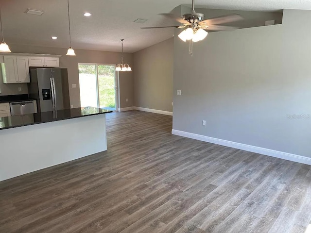 9252 N Agatha Dr, Citrus Springs, FL 34434 - kitchen featuring stainless steel appliances, dark countertops, baseboards, a ceiling fan, and a chandelier