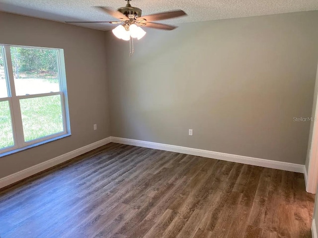 9252 N Agatha Dr, Citrus Springs, FL 34434 - empty room featuring baseboards, dark wood finished floors, a ceiling fan, and a textured ceiling