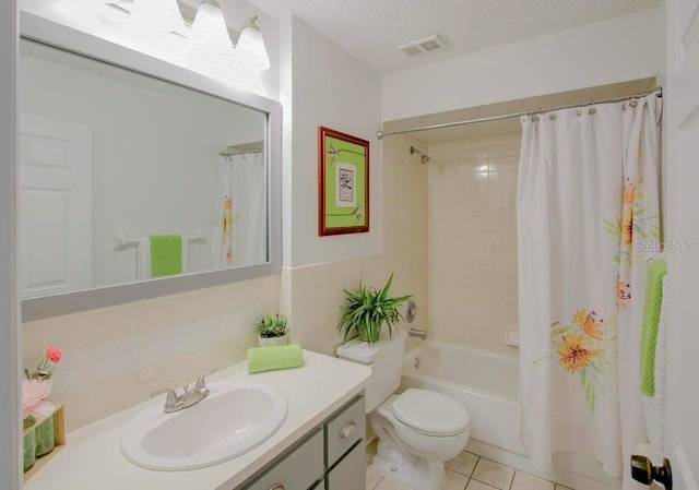 full bath featuring shower / bath combination with curtain, vanity, toilet, and tile patterned floors