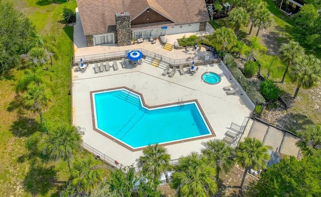 view of pool featuring fence