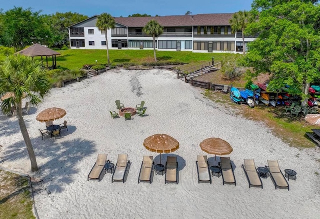 surrounding community with a yard and a gazebo
