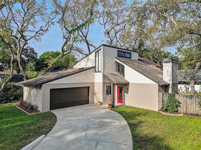 10910 Winter Oak Pl, Tampa, FL 33618 - mid-century inspired home with an attached garage, concrete driveway, stucco siding, and a chimney