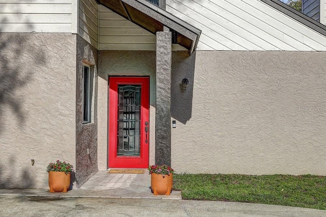 10910 Winter Oak Pl, Tampa, FL 33618 - doorway to property featuring stucco siding