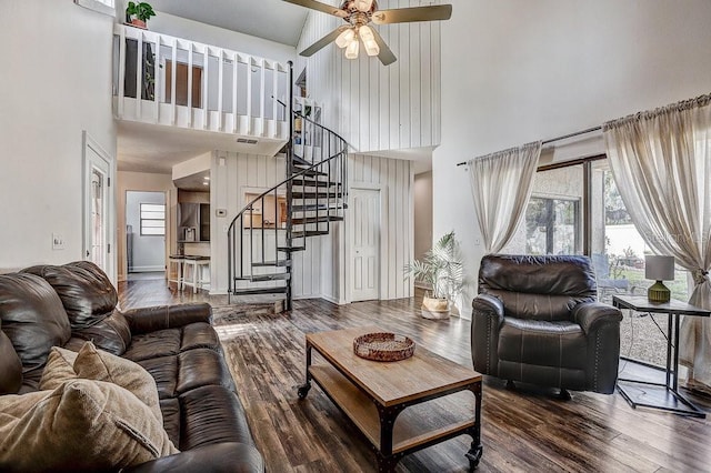 10910 Winter Oak Pl, Tampa, FL 33618 - living area with a high ceiling, stairway, wood finished floors, a ceiling fan, and baseboards