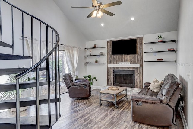 10910 Winter Oak Pl, Tampa, FL 33618 - living room with wood finished floors, a ceiling fan, a large fireplace, recessed lighting, and high vaulted ceiling