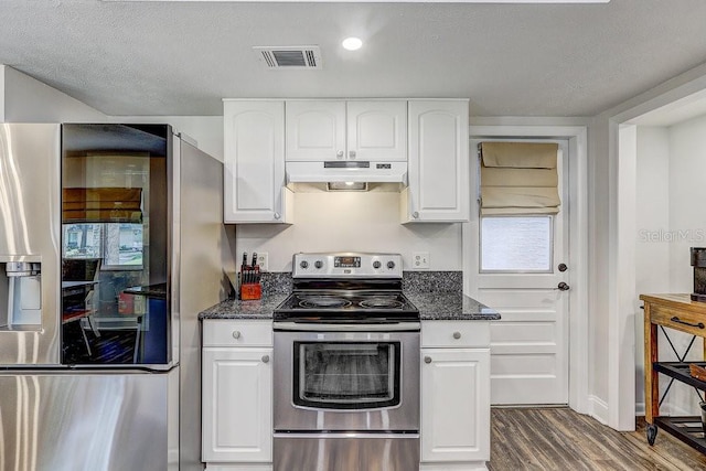 10910 Winter Oak Pl, Tampa, FL 33618 - kitchen featuring stainless steel appliances, under cabinet range hood, dark wood-style flooring, and white cabinetry