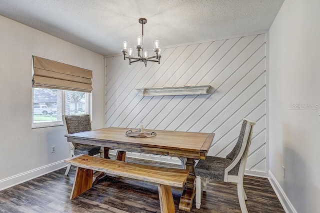 10910 Winter Oak Pl, Tampa, FL 33618 - dining area with a chandelier, dark wood-style flooring, baseboards, and a textured ceiling