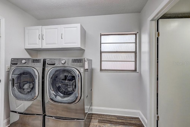 10910 Winter Oak Pl, Tampa, FL 33618 - laundry room featuring washer and clothes dryer, cabinet space, wood finished floors, baseboards, and a textured ceiling