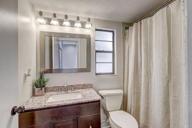 10910 Winter Oak Pl, Tampa, FL 33618 - full bath with a textured ceiling, vanity, and toilet