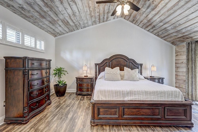 10910 Winter Oak Pl, Tampa, FL 33618 - bedroom featuring wood ceiling, lofted ceiling, baseboards, wood finished floors, and a ceiling fan