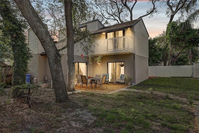 10910 Winter Oak Pl, Tampa, FL 33618 - back of house with a balcony, a patio area, and stucco siding