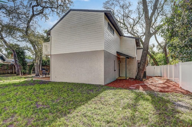 10910 Winter Oak Pl, Tampa, FL 33618 - view of home's exterior featuring a patio area and stucco siding