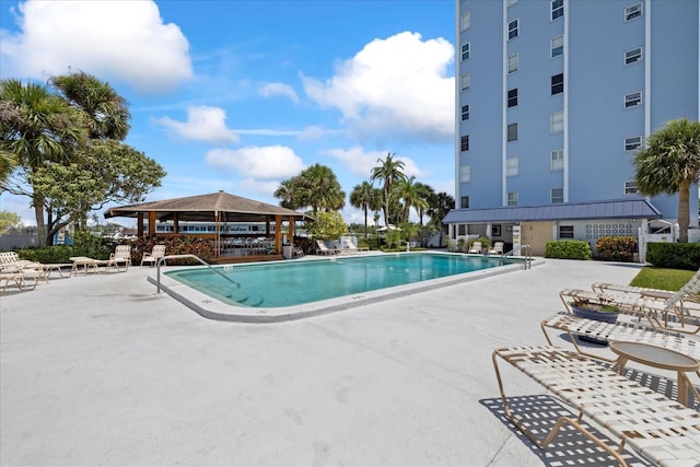 community pool featuring a gazebo and a patio
