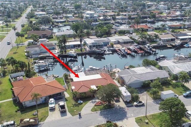 aerial perspective of suburban area featuring a nearby body of water