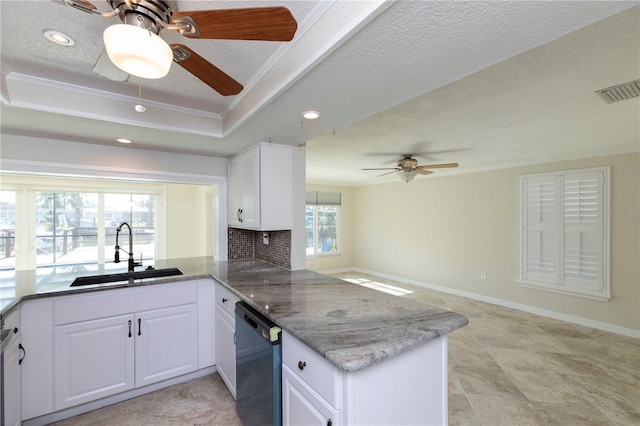 kitchen with a sink, a ceiling fan, dishwashing machine, a peninsula, and white cabinetry