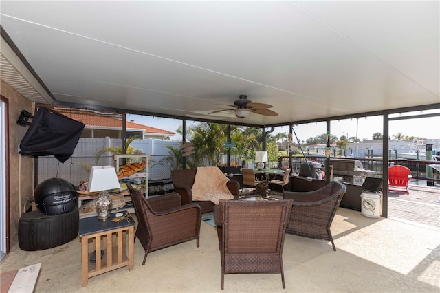 view of patio / terrace featuring a ceiling fan, outdoor dining space, and fence