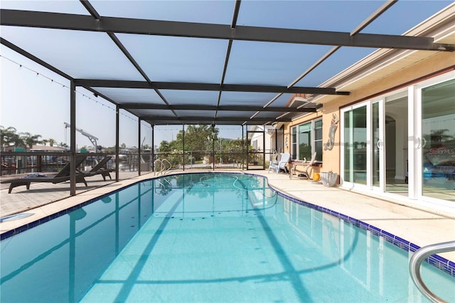 swimming pool with a patio and a lanai
