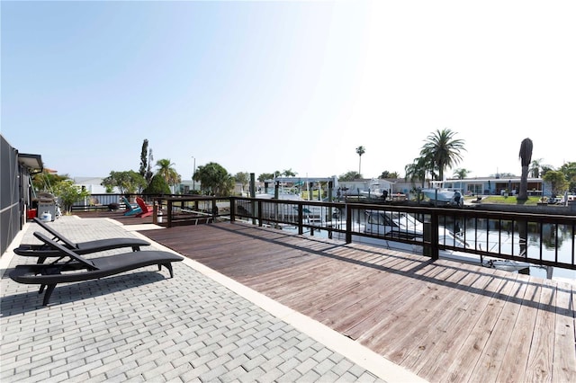 wooden deck with a water view