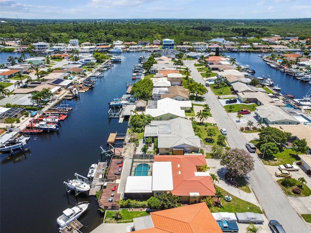 aerial view of residential area featuring a nearby body of water