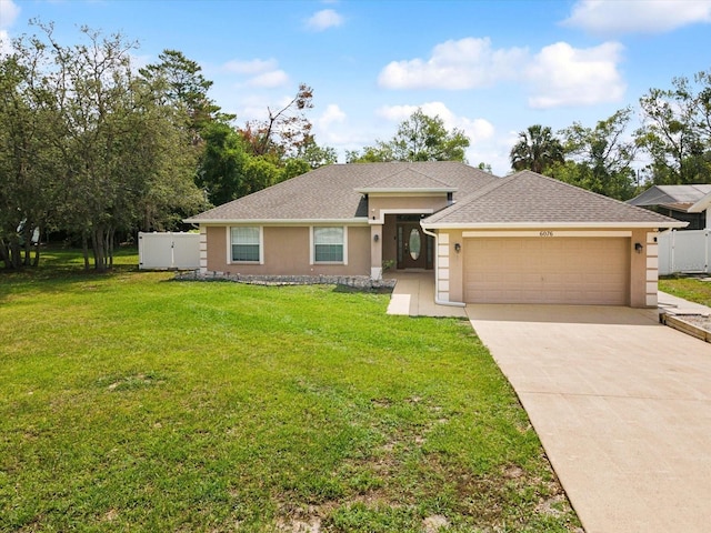 ranch-style home featuring stucco siding, an attached garage, driveway, and roof with shingles