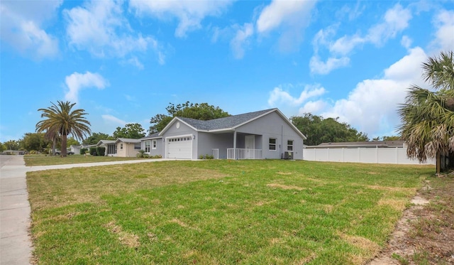 view of front of home with a garage, concrete driveway, and stucco siding