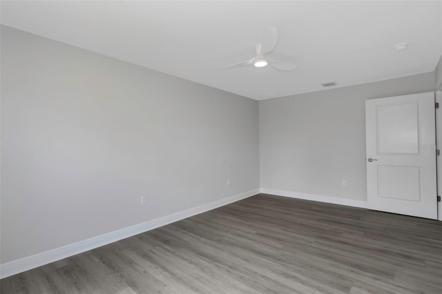 unfurnished room featuring ceiling fan, baseboards, and wood finished floors