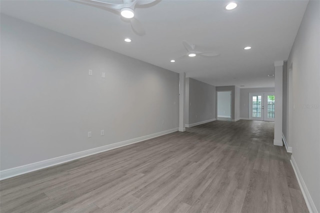 spare room featuring ceiling fan, wood finished floors, recessed lighting, and baseboards