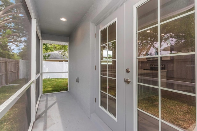 unfurnished sunroom featuring french doors