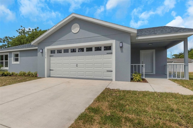 ranch-style home with a garage, stucco siding, driveway, and a front yard