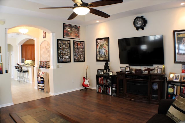 4837 Rainbow Race, New Port Richey, FL 34652 - living room featuring arched walkways, ceiling fan, wood finished floors, recessed lighting, and ornate columns