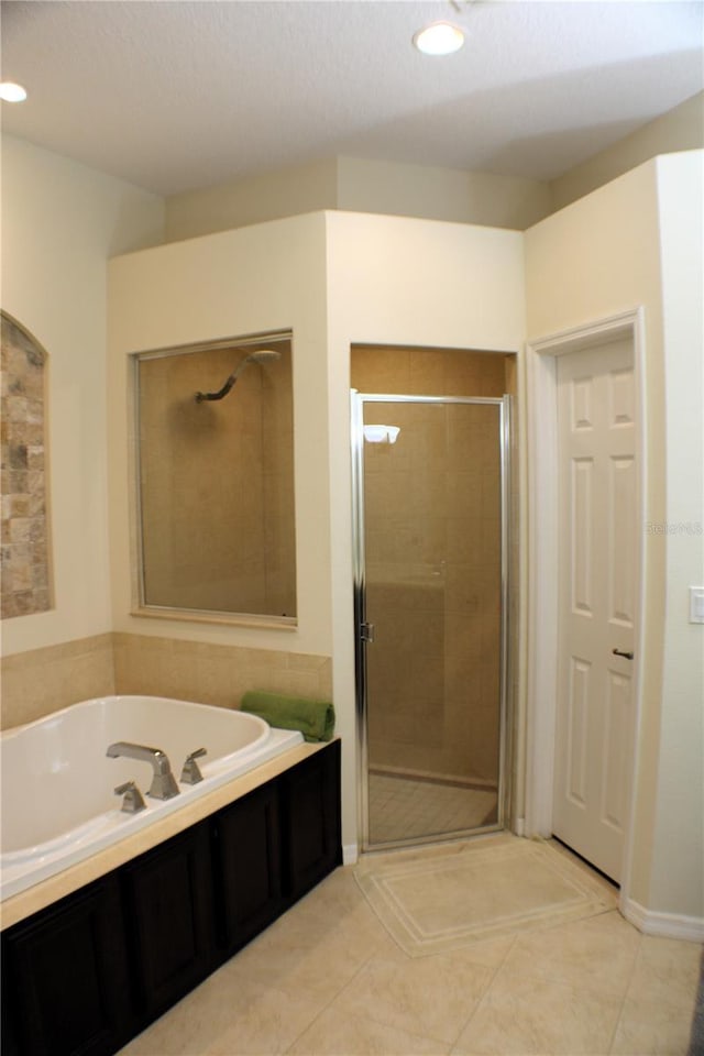 4837 Rainbow Race, New Port Richey, FL 34652 - bathroom with a shower stall, a bath, tile patterned flooring, and recessed lighting