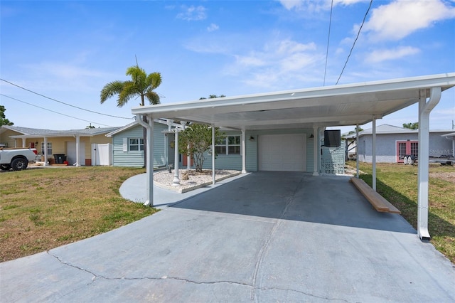 13411 Lisa Dr, Hudson, FL 34667 - view of front facade featuring a front lawn, a garage, driveway, and an attached carport