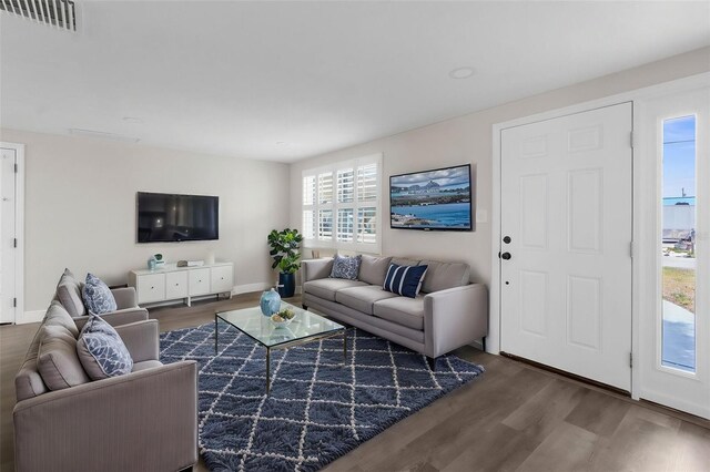 13411 Lisa Dr, Hudson, FL 34667 - living area featuring wood finished floors and baseboards
