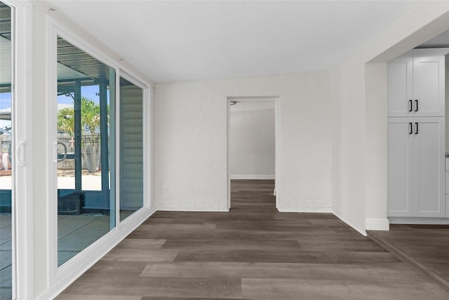 13411 Lisa Dr, Hudson, FL 34667 - unfurnished room with dark wood-type flooring and baseboards