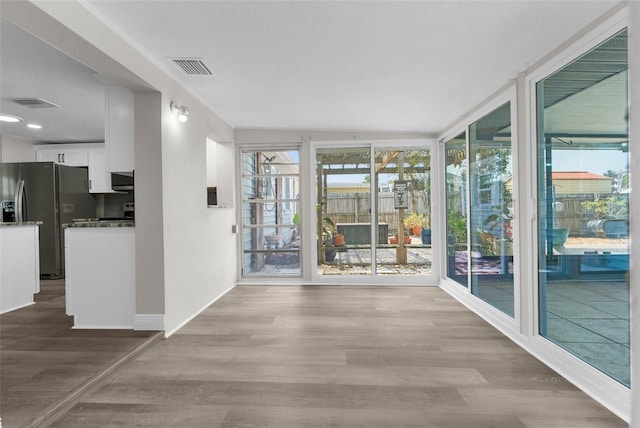 13411 Lisa Dr, Hudson, FL 34667 - interior space featuring wood finished floors and baseboards