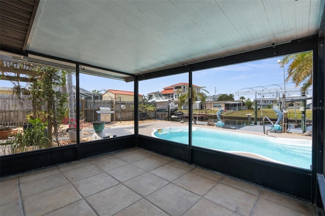 13411 Lisa Dr, Hudson, FL 34667 - unfurnished sunroom with a water view